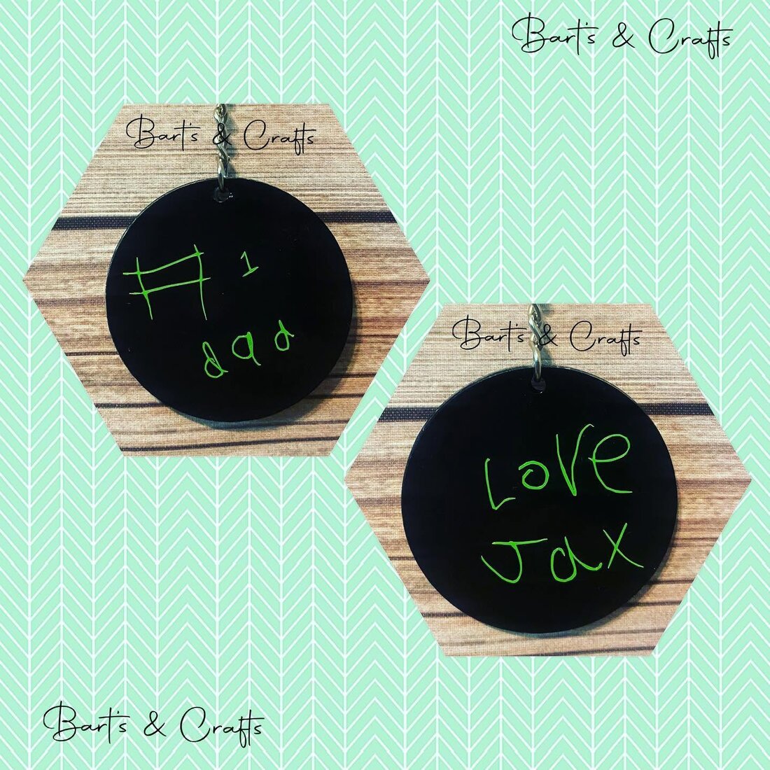 Two black acrylic keychains with a child's real handwriting cut in vinyl reading number-one dad and Love Jax